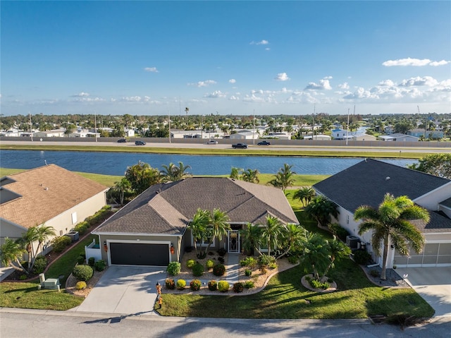 drone / aerial view featuring a water view