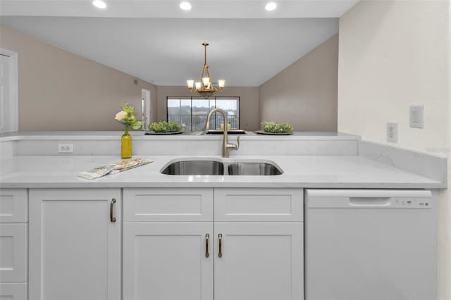 kitchen featuring a notable chandelier, white dishwasher, sink, and white cabinets