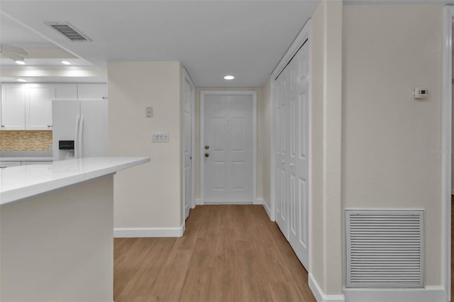 hallway featuring light hardwood / wood-style flooring