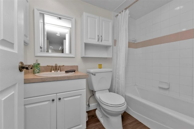 full bathroom with vanity, toilet, hardwood / wood-style flooring, and shower / bath combo