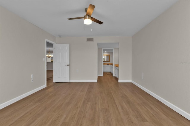 unfurnished bedroom with ceiling fan and light wood-type flooring