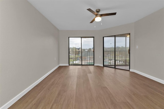 spare room featuring ceiling fan and light wood-type flooring