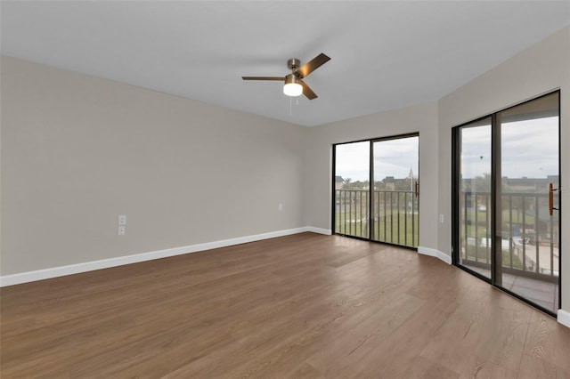 spare room featuring hardwood / wood-style flooring and ceiling fan