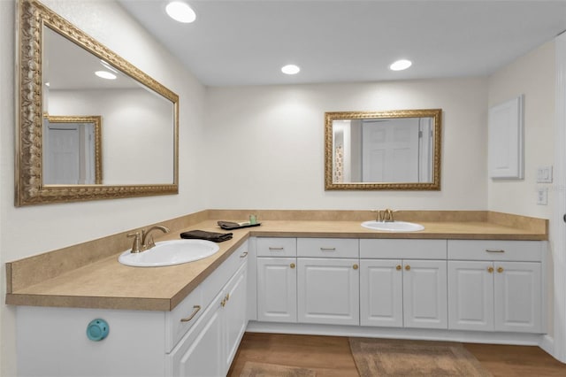 bathroom with vanity and hardwood / wood-style floors