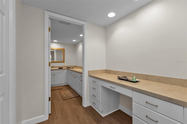 bathroom featuring vanity and hardwood / wood-style flooring