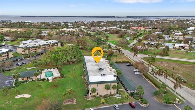 birds eye view of property with a water view