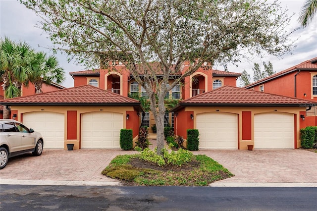 mediterranean / spanish house featuring a garage