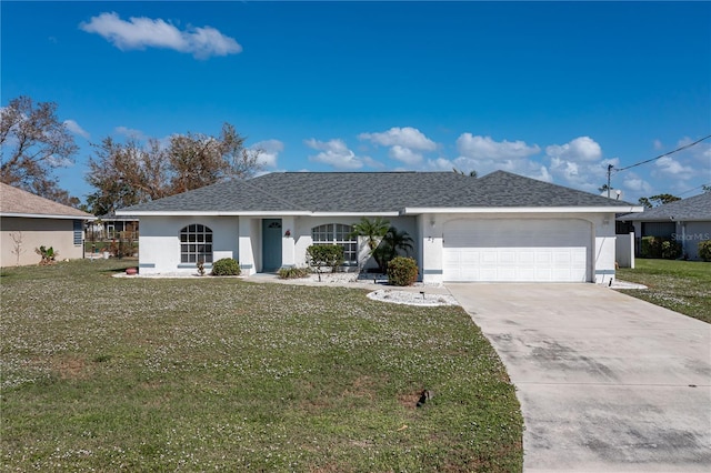 ranch-style house featuring a front yard and a garage