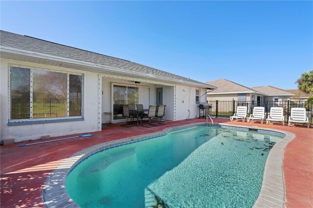 view of swimming pool featuring a patio area