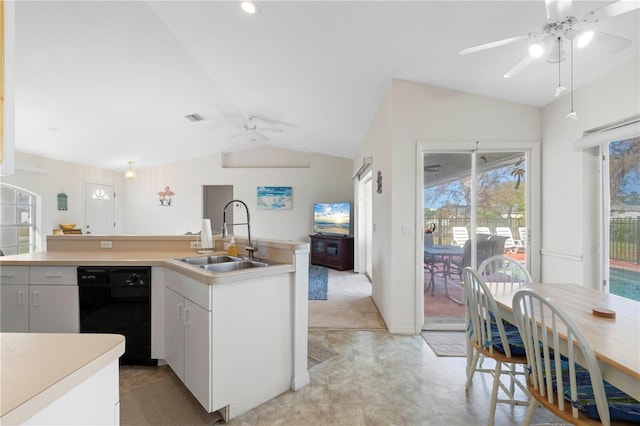 kitchen featuring black dishwasher, ceiling fan, white cabinetry, vaulted ceiling, and sink