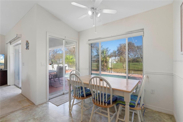 dining space with lofted ceiling and ceiling fan