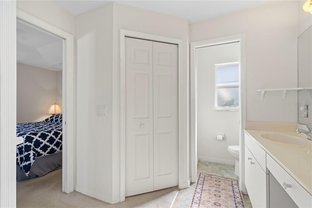 bathroom with vanity and toilet