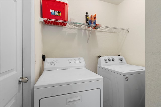 laundry room featuring washing machine and clothes dryer