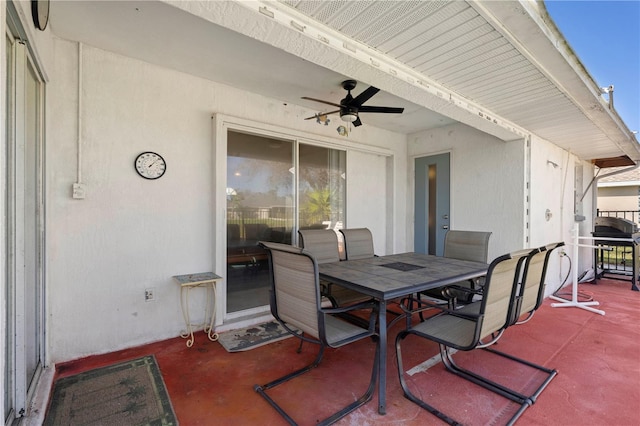 view of patio featuring ceiling fan