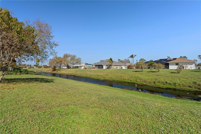 view of yard with a water view