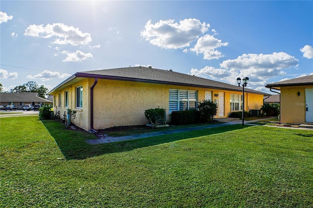 view of home's exterior with a yard