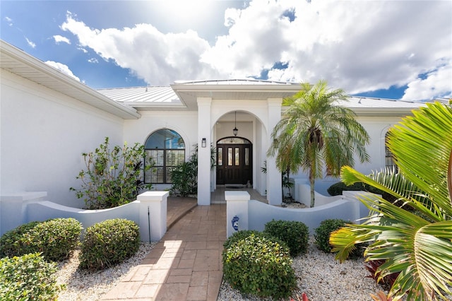 1945 Jamaica Way, Punta Gorda, FL 33950 - property entrance with stucco siding, a metal roof, and a standing seam roof