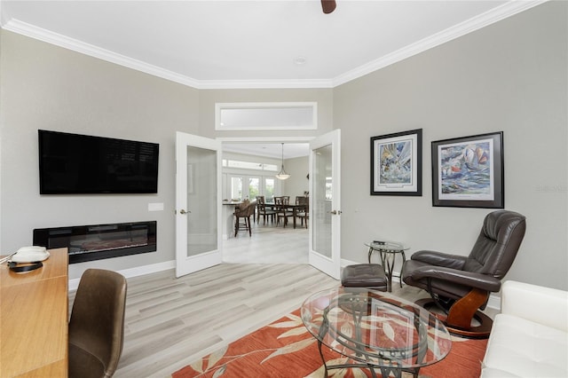 living room featuring french doors, crown molding, and wood-type flooring