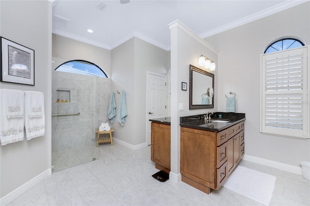 bathroom with walk in shower, vanity, and ornamental molding