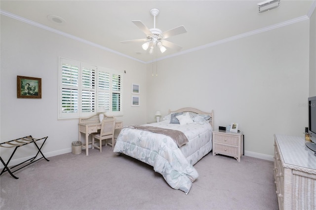 carpeted bedroom with ornamental molding and ceiling fan