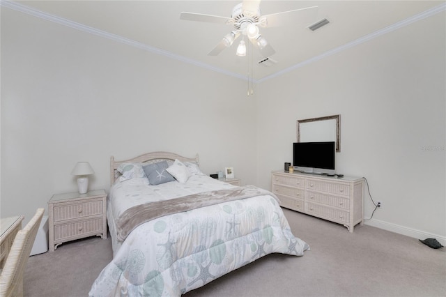 carpeted bedroom featuring ornamental molding and ceiling fan