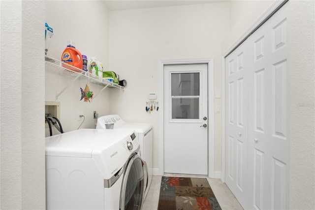 laundry area with separate washer and dryer