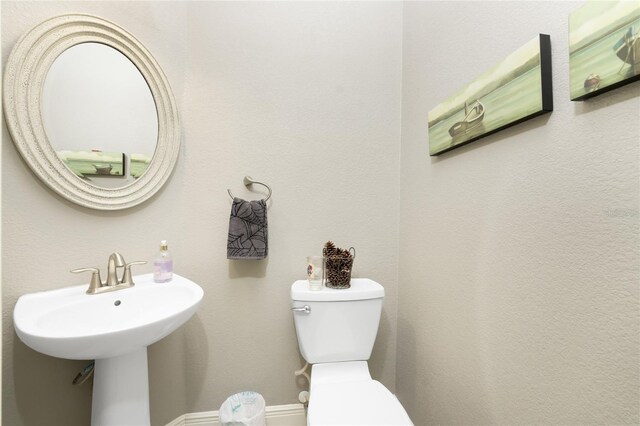 1945 Jamaica Way, Punta Gorda, FL 33950 - bathroom featuring toilet and baseboards