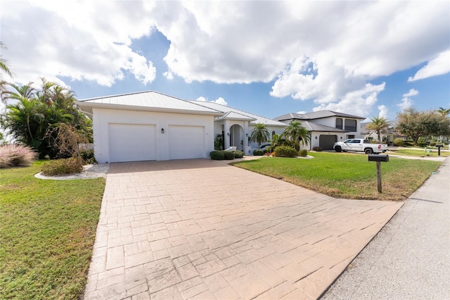 ranch-style house with a front yard and a garage