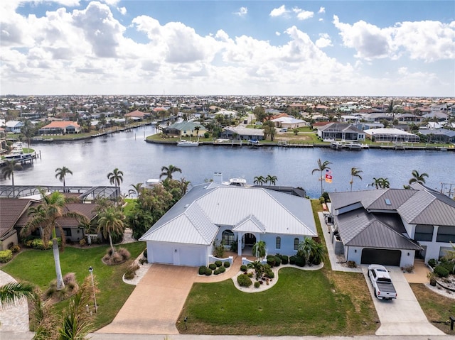 birds eye view of property with a water view