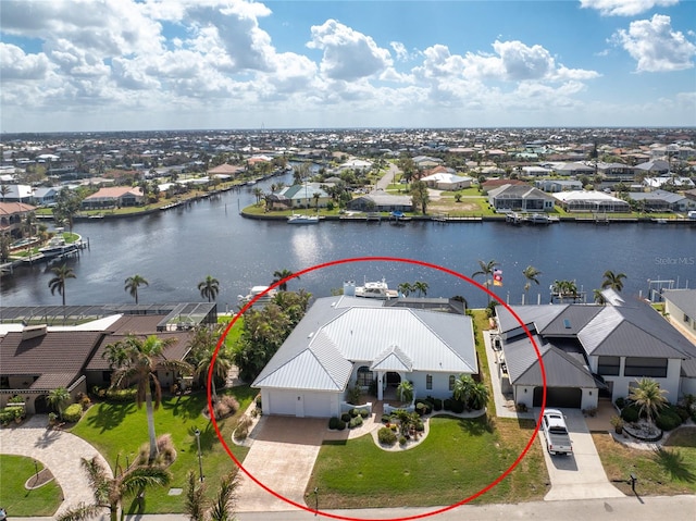 birds eye view of property with a water view