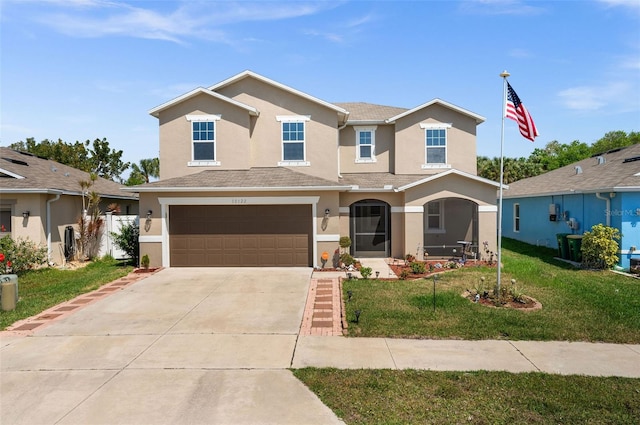 view of front of house featuring a garage and a front yard