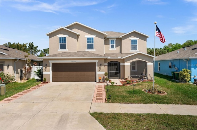 10122 Winding River Rd, Punta Gorda, FL 33950 - traditional-style house with stucco siding, a front lawn, driveway, and an attached garage