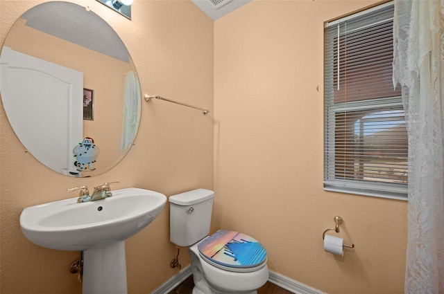 10122 Winding River Rd, Punta Gorda, FL 33950 - bathroom with baseboards and toilet
