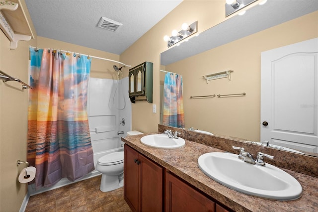 full bathroom featuring toilet, shower / tub combo, vanity, and a textured ceiling