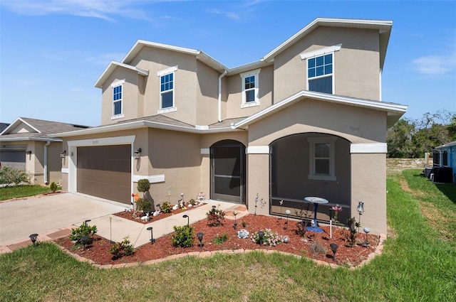 10122 Winding River Rd, Punta Gorda, FL 33950 - view of front of house with stucco siding, a garage, a front lawn, and driveway
