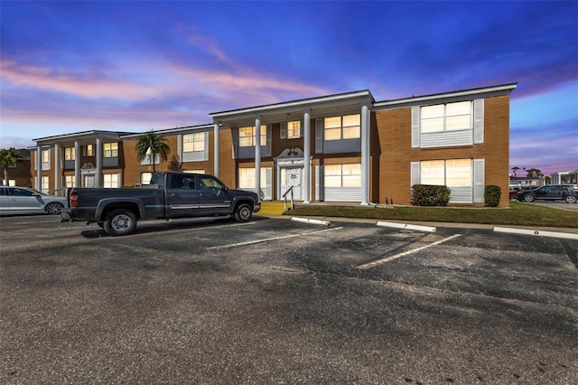 view of outdoor building at dusk