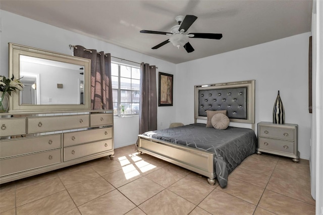 tiled bedroom featuring ceiling fan