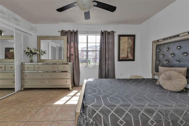 bedroom with light tile patterned flooring and ceiling fan