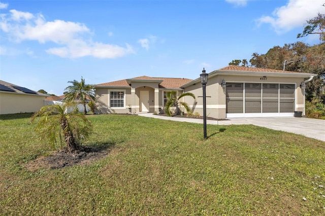 view of front of house featuring a front yard and a garage