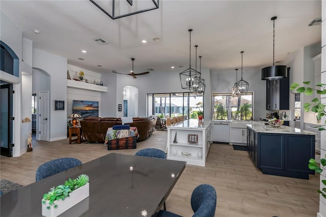 dining space featuring light hardwood / wood-style flooring and a notable chandelier