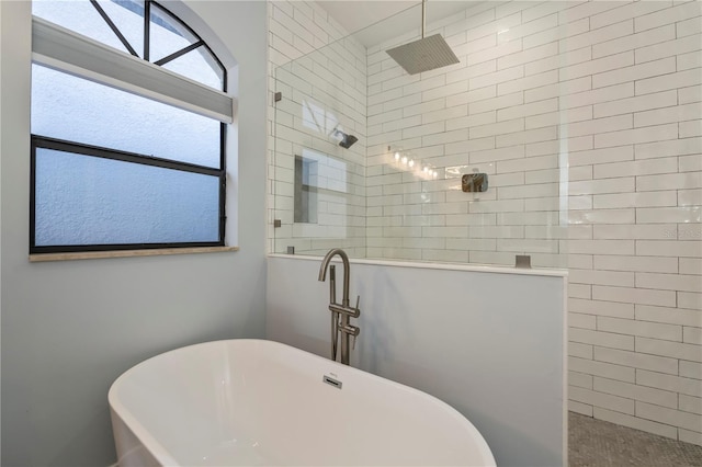 bathroom with shower with separate bathtub