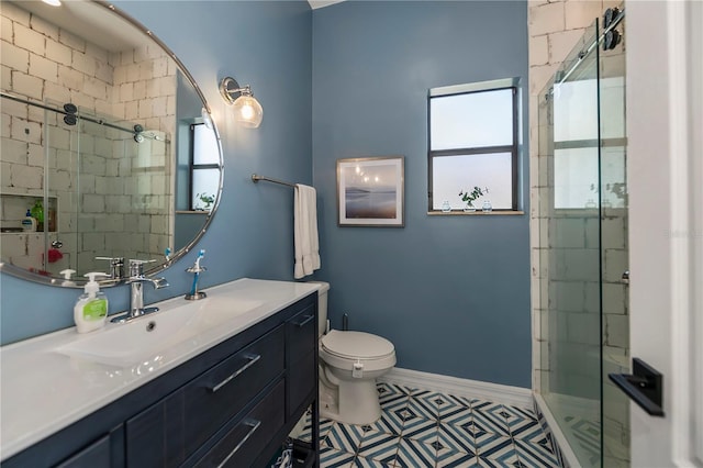 bathroom featuring vanity, toilet, tile patterned flooring, and an enclosed shower