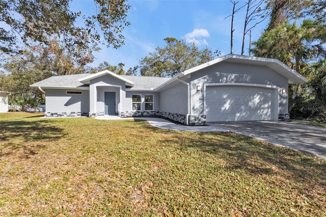 ranch-style house featuring a garage and a front lawn