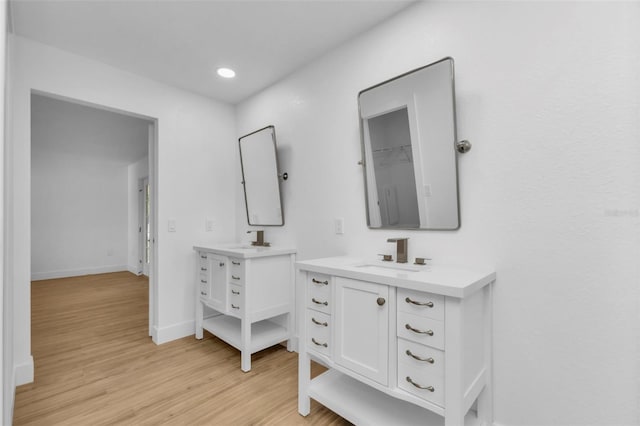 bathroom featuring hardwood / wood-style floors and vanity