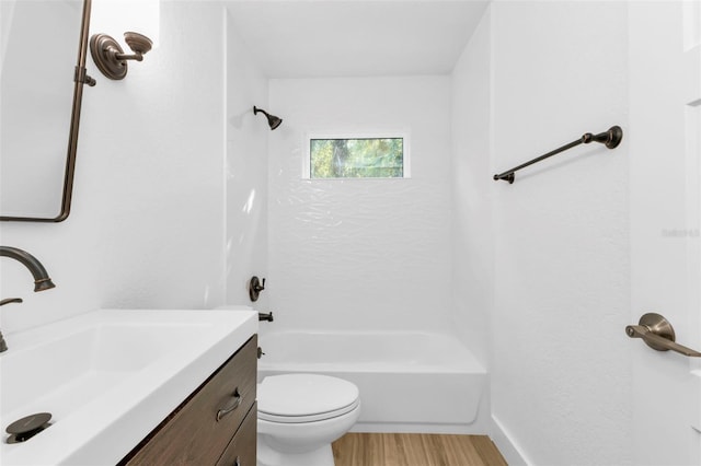 full bathroom featuring hardwood / wood-style flooring, shower / tub combination, vanity, and toilet