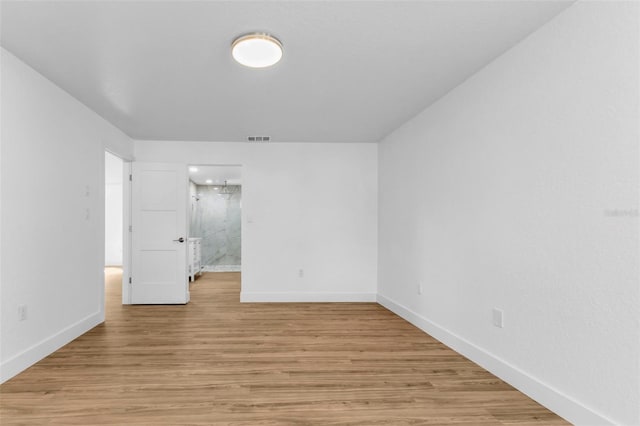 spare room featuring light wood-type flooring