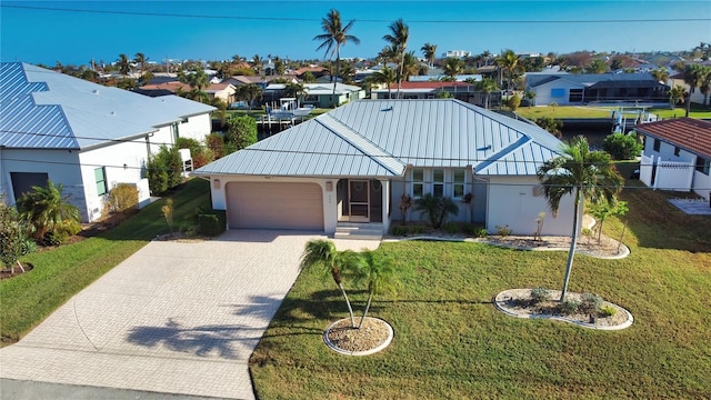 view of front of home featuring a garage and a front yard