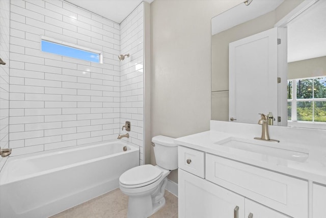 full bathroom featuring vanity, tile patterned floors, tiled shower / bath combo, and toilet