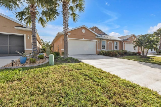 ranch-style home with a garage and a front yard