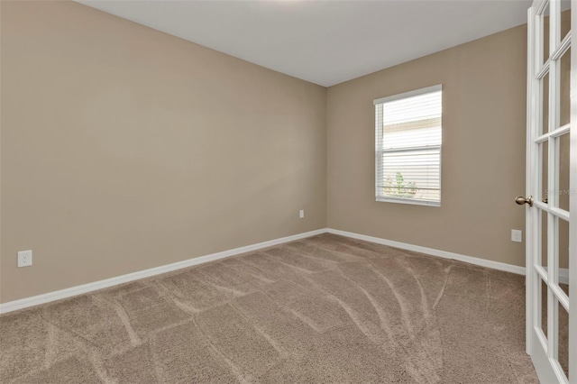 spare room featuring carpet floors